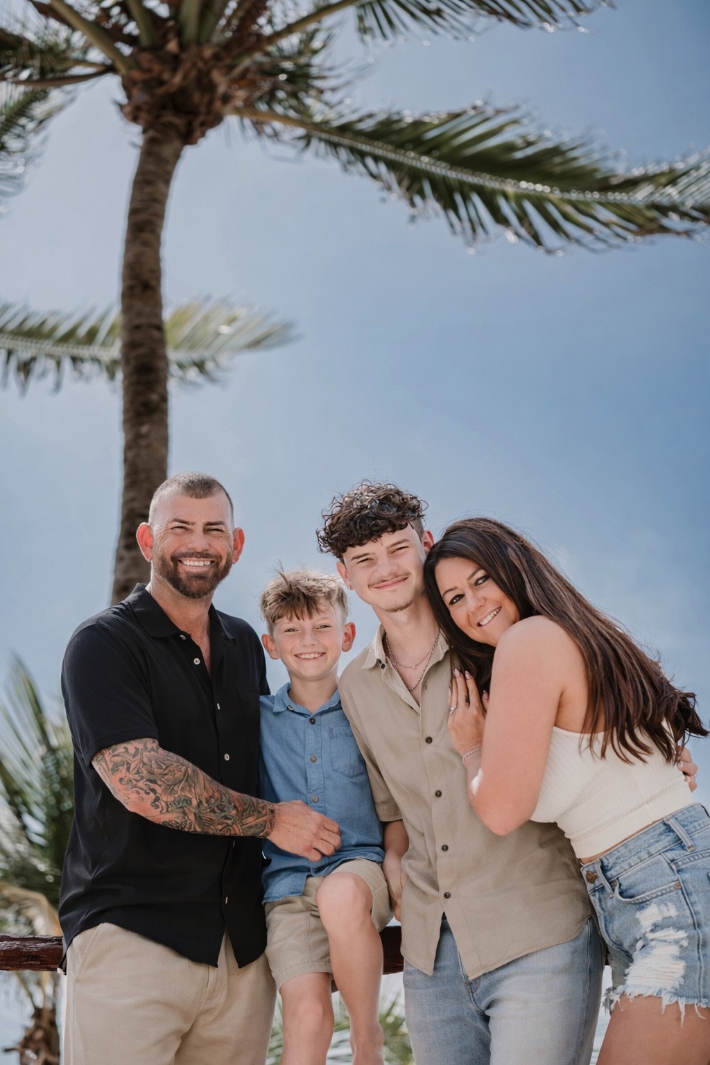 Maurice McLeod with his wife Courtney and their two sons